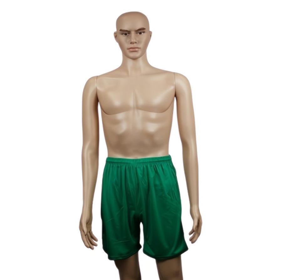 Plain green football shorts, size 10